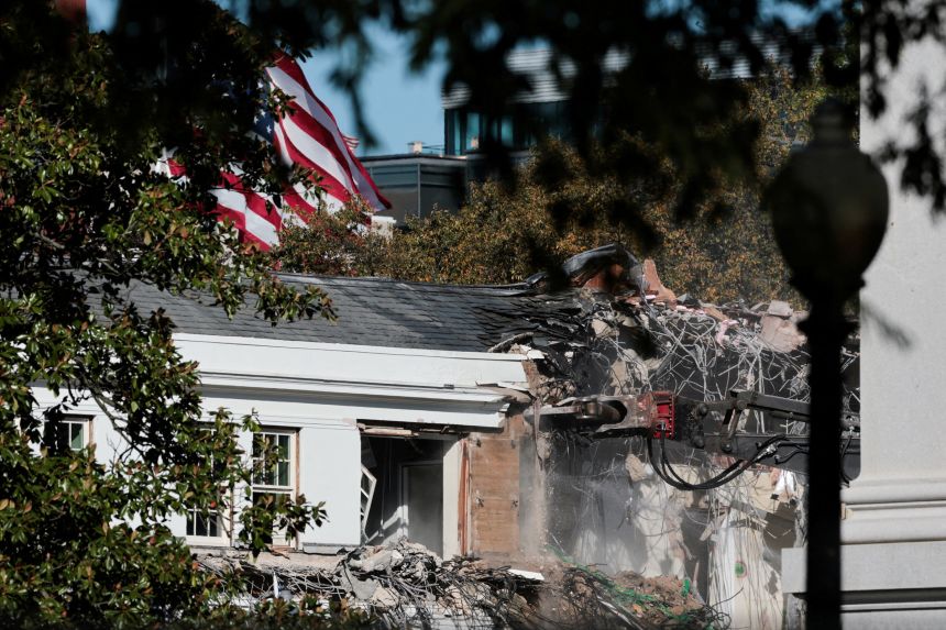 A demolition crew takes apart the facade of the East Wing of the White House, where President Donald Trump's proposed ballroom is being built, in Washington, DC, on Tuesday.