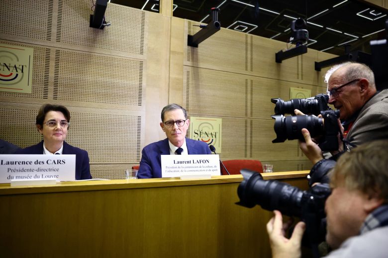 Laurence des Cars, president and director of the Louvre Museum, sits next to French Senator Laurent Lafon before the start of a hearing in Paris, France, on Wednesday.