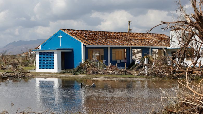 A building stands amid torn tree branches, in an affected area, after Hurricane Melissa made landfall in Black River, Jamaica, on October 30, 2025.