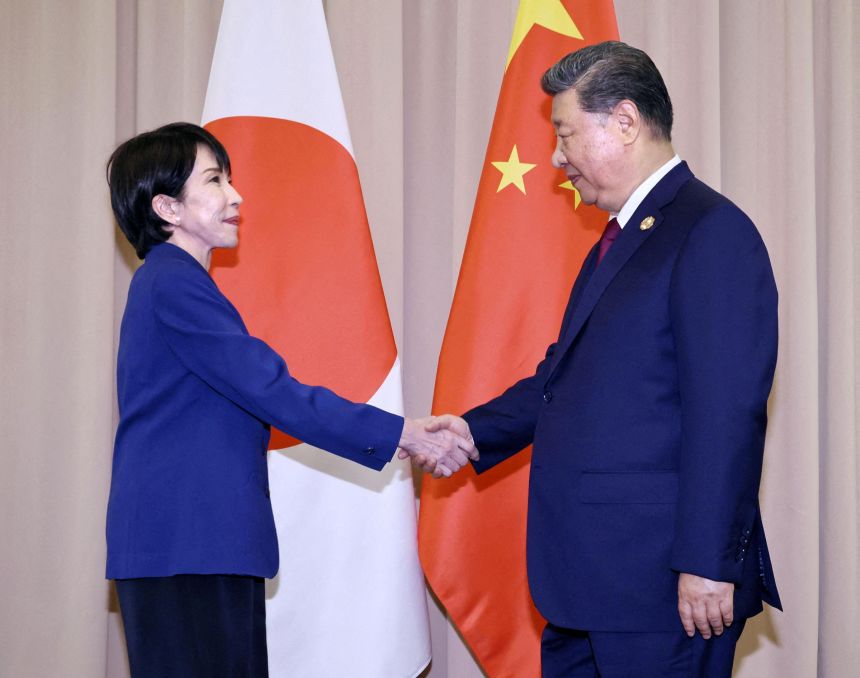 Japanese Prime Minister Sanae Takaichi shakes hands with Chinese President Xi Jinping ahead of their talks in Gyeongju, South Korea, October 31, 2025 in this photo distributed by Kyodo.