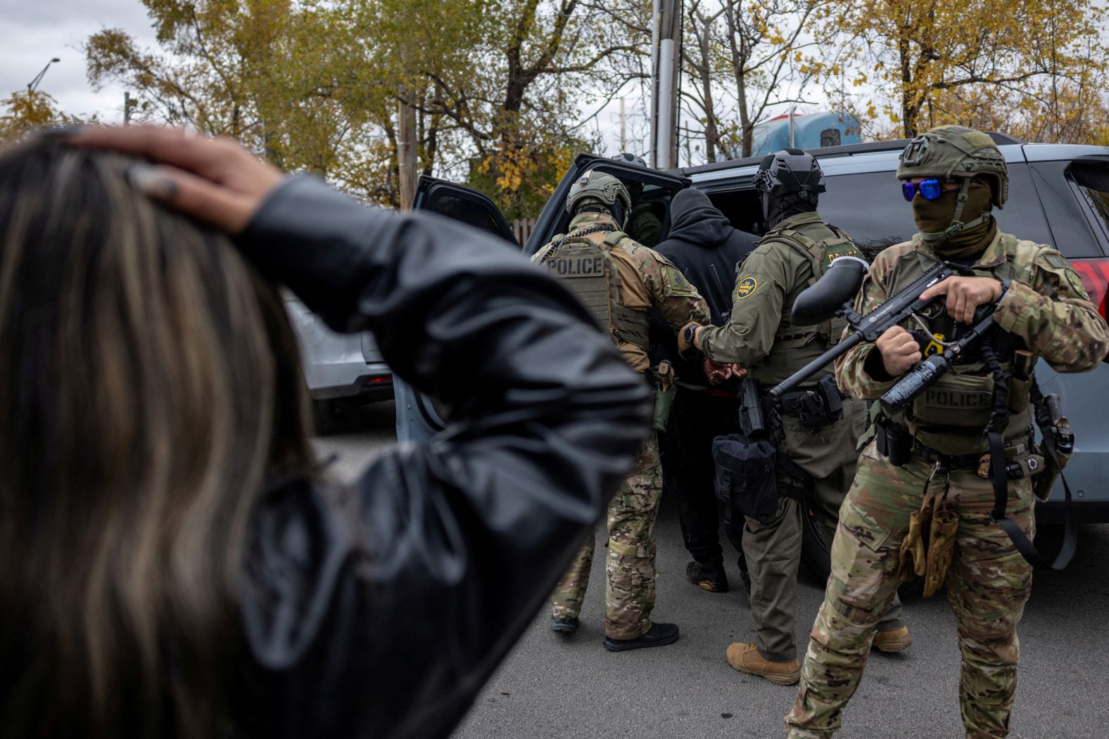 Federal agents detain a man during an immigration raid in Cicero, Illinois, on Saturday, November 8. <a href="index.php?page=&url=https%3A%2F%2Fwww.cnn.com%2F2025%2F11%2F10%2Fus%2Fdhs-ice-immigrants-chicago-shooting">Chicago has emerged as the center of tense standoffs</a> between federal agents carrying out immigration enforcement operations and frustrated and angry community members protesting the Trump administration’s wide-ranging deportation campaign.