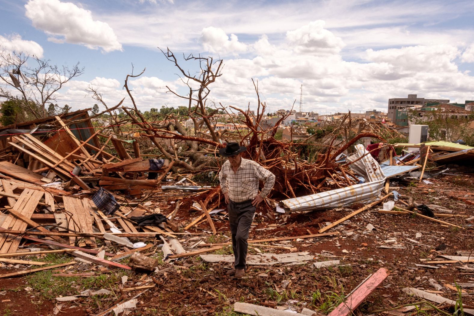 Jose Sabaldini walks through the debris of his home in Rio Bonito do Iguaçu, Brazil, on Sunday, November 9. <a href="index.php?page=&url=https%3A%2F%2Fwww.cnn.com%2F2025%2F11%2F08%2Famericas%2Fbrazil-tornado-weather-parana-intl">A deadly tornado</a> tore through a state in southern Brazil, killing six people and injuring at least 750, local authorities said.