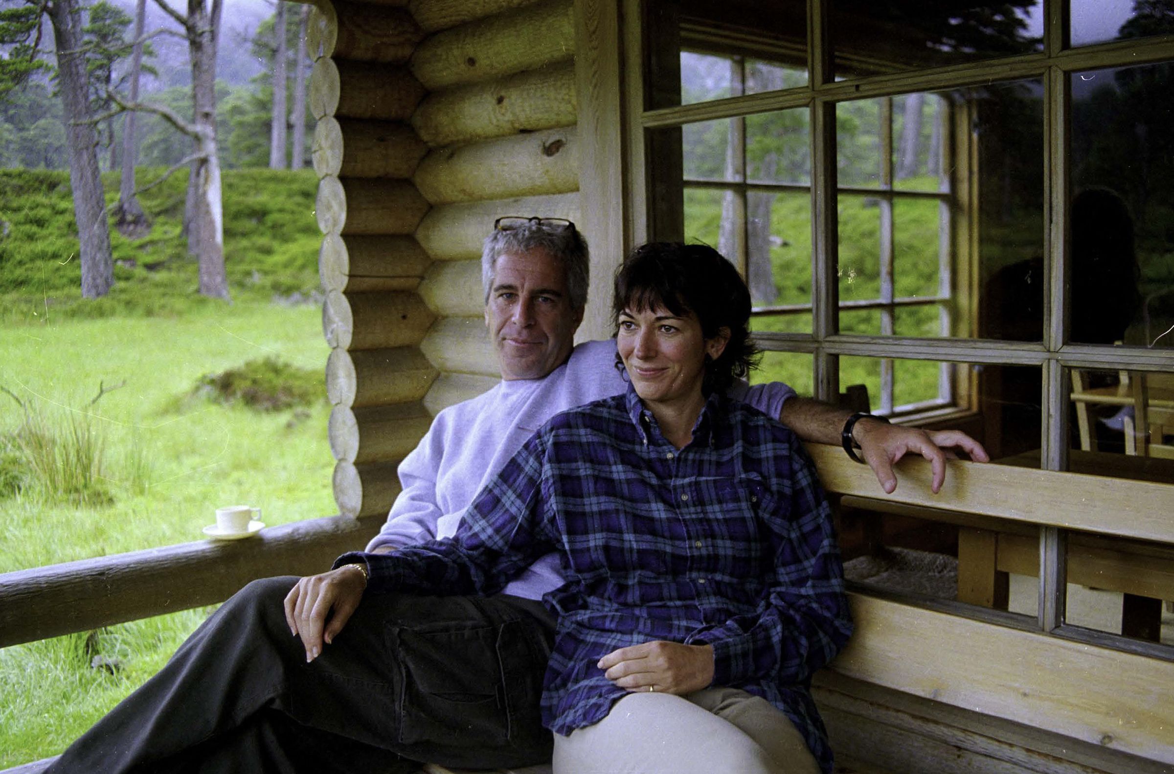 This undated trial evidence image obtained December 8, 2021, from the US District Court for the Southern District of New York shows British socialite Ghislaine Maxwell and US financier Jeffrey Epstein in Queen's log cabin at Balmoral. This undated trial evidence image obtained December 8, 2021, from the US District Court for the Southern District of New York shows British socialite Ghislaine Maxwell and US financier Jeffrey Epstein in Queen's log cabin at Balmoral.