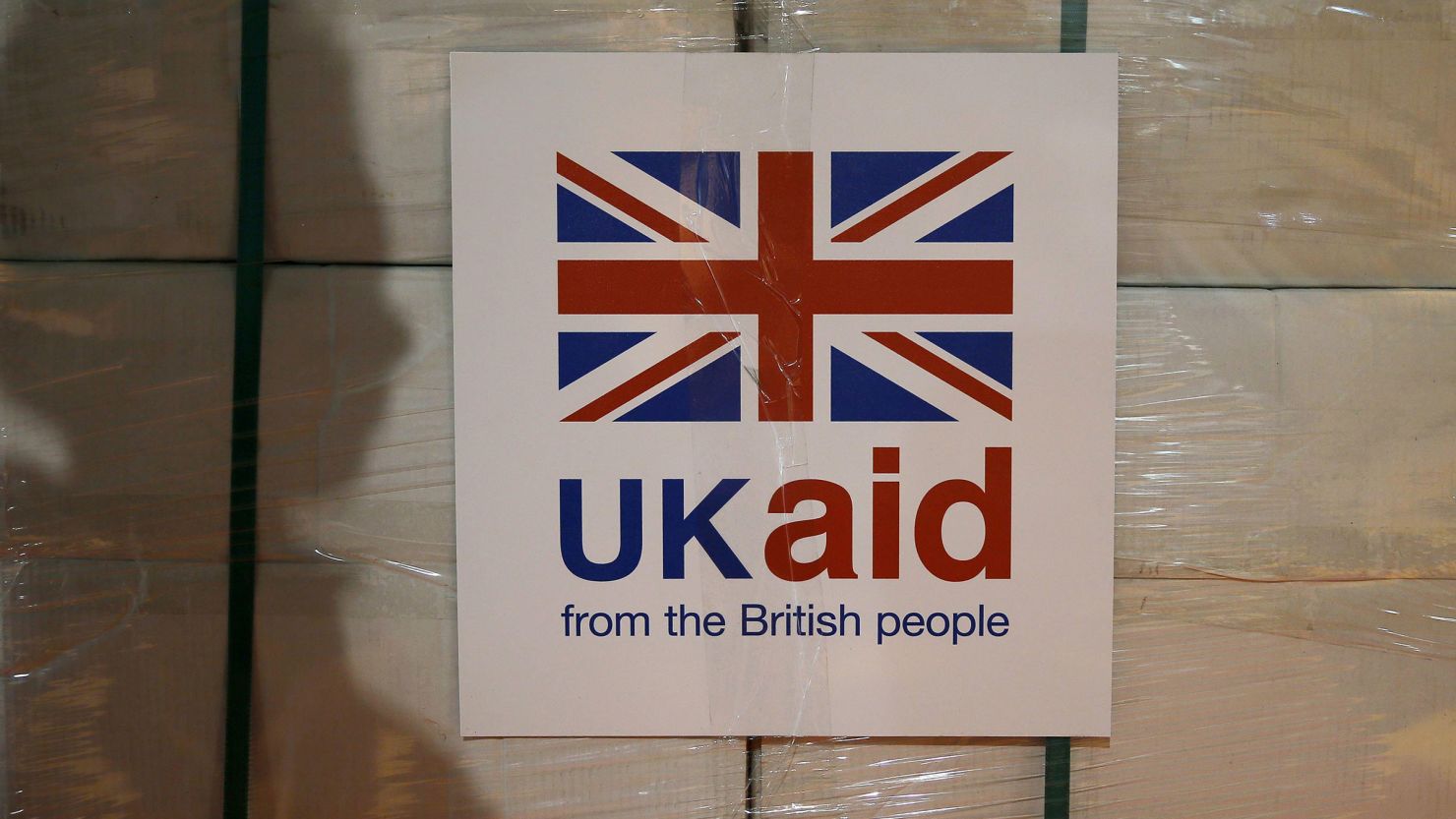 A UK aid label is attached to a box containing kitchen sets at a UK aid Disaster Response Centre in Gloucestershire, England.