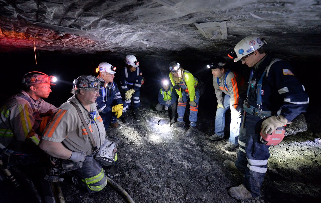 In this January 2015 photo, Joe Main, third from left, Assistant Secretary of Labor for Mine Safety and Health, and Patricia Silvey, center, Deputy Assistant Secretary for Operations with MSHA, speak with workers at the Gibson North mine in Princeton, Indiana.