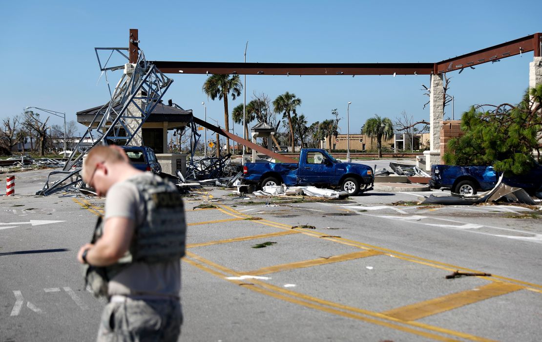 In this October 2018 photo, soldiers are protected at the damaged entrance to Tyndal Air Force Base in Panama City, Florida in the aftermath of Hurricane Michael.