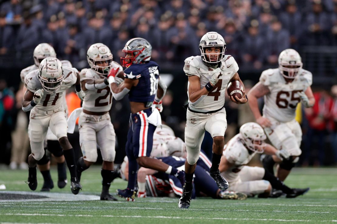 Army quarterback Christian Anderson runs for a touchdown against Navy during the first half of the Army-Navy game in December 2021. 