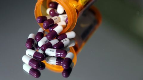 Pills spill out of a medicine bottle in this 2018 photo.