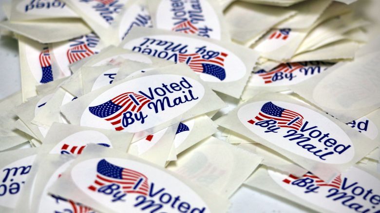 Stickers reading "I Voted By Mail" are displayed as the Wayne County Board of Elections prepares absentee ballots in Goldsboro, North Carolina, in September 2022.