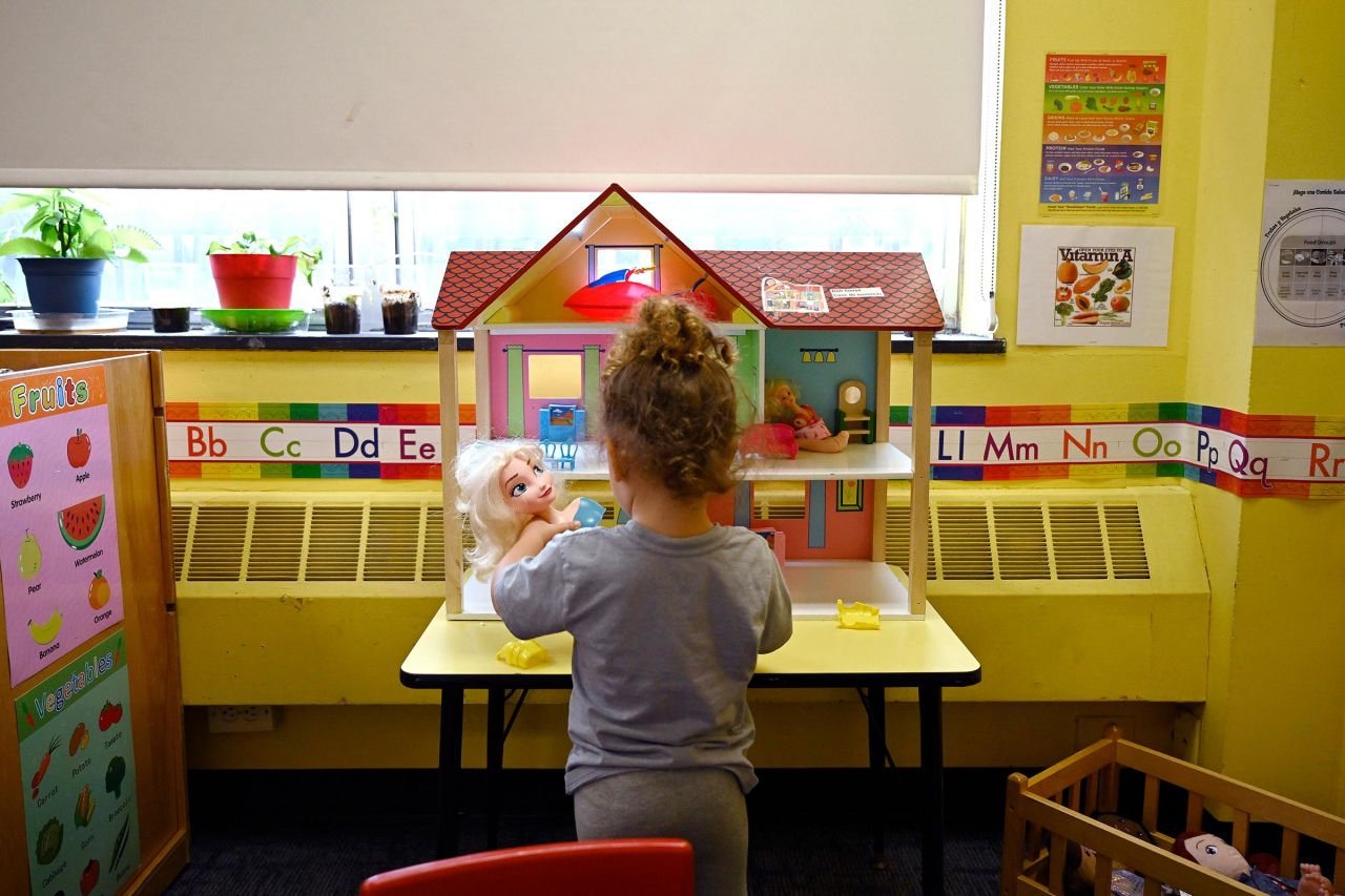 A child plays with dolls at a Head Start program in Bridgeport, Connecticut, on September 28, 2023.