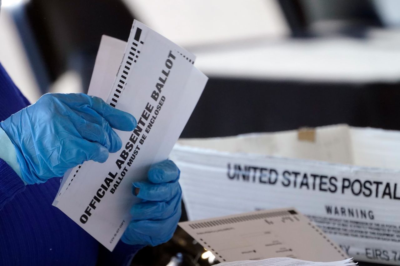 This November 2020 file photo shows a worker processing absentee ballots in Atlanta.