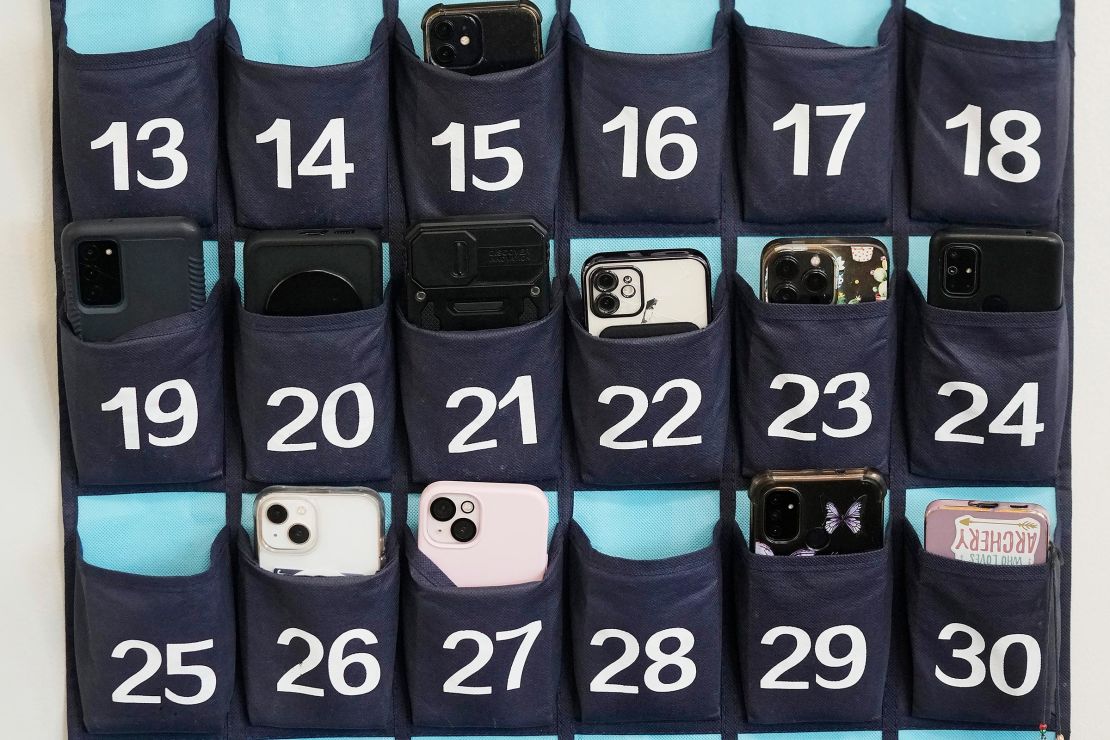 In this 2024 photo, a phone holder hangs in a classroom at Delta High School in Delta, Utah. Utah state lawmakers sent a bill banning cellphones in schools to Gov. Spencer Cox's desk this February.