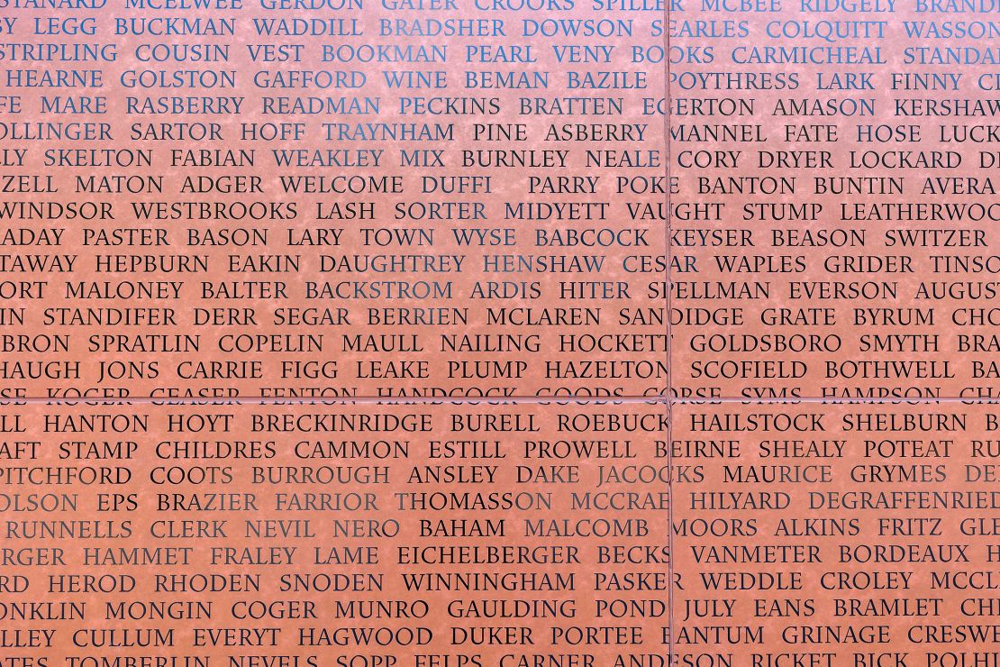 A close up of the last names of the formerly ensalved enscribed on the National Monument to Freedom in Montgomery, Alabama.