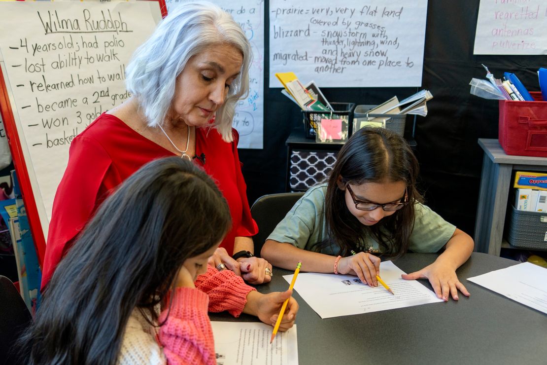 In this photo provided by the Tennessee Department of Education, 2nd grade teacher Missy Testerman, center, who teaches English as a second language, works with students Dafne Lozano, left, and Dwiti Patel, right, at the Rogersville City School on Thursday, March 13, in Rogersville, Tennessee. 