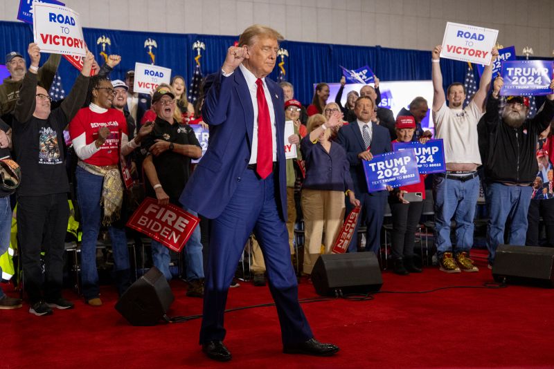 Republican presidential candidate former President Donald Trump takes to the stage before speaking on April 2 in Green Bay, Wisconsin.