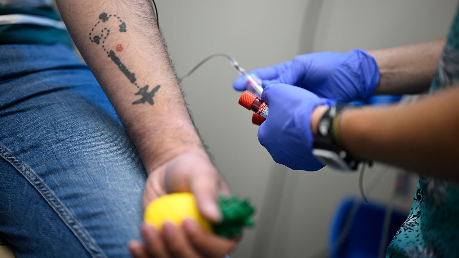 A Latino man has his blood drawn for HIV testing at Pineapple Healthcare in Orlando, Florida, on May 28, 2024.