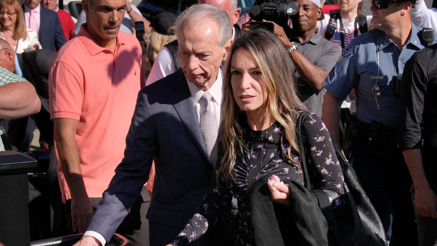 Karen Read arrives at Norfolk Superior Court with her father, William Read, center left, on Tuesday.