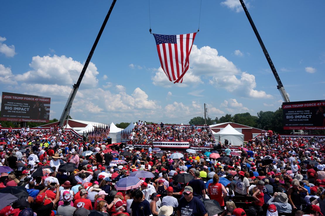 A crowd waits in the sun for Republican presidential candidate former President Donald Trump to speak at a campaign event in Butler, Pennsylvania, on July 13.
