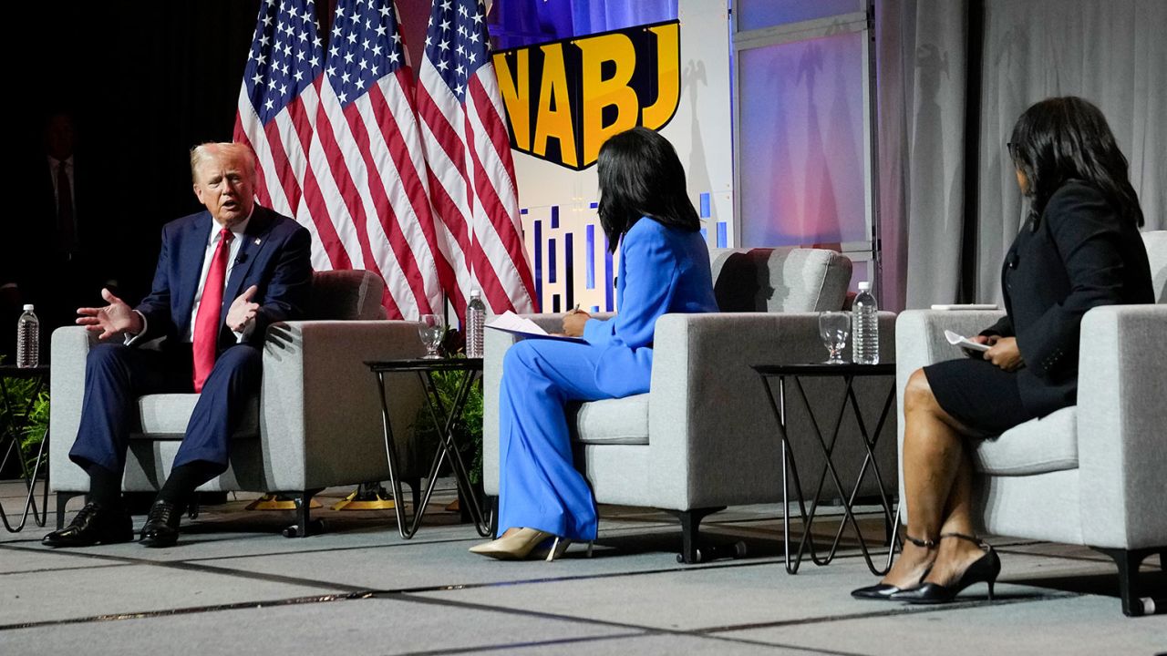Republican presidential candidate former President Donald Trump, left, moderated by from left, ABC's Rachel Scott, Semafor's Nadia Goba and FOX News' Harris Faulkner, speaks at the National Association of Black Journalists, NABJ, convention, Wednesday, July 31, 2024, in Chicago. (AP Photo/Charles Rex Arbogast)
