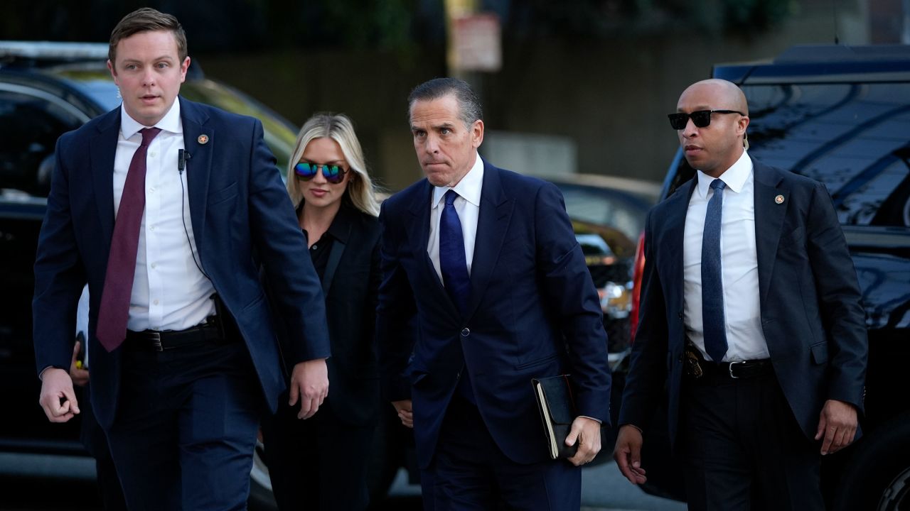 Hunter Biden, center, and his wife Melissa Cohen Biden, arrive in federal court for jury selection for his trial on felony tax charges on Thursday, September 5, in Los Angeles.