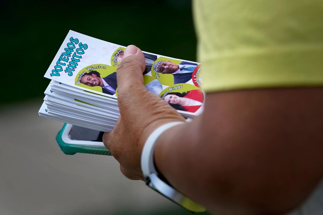 Elena Jimenez carries a voting guide during a voter engagement event for the Latino community in Greensboro, North Carolina, on September 21. 