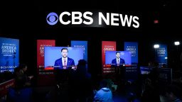 Viewers in the spin room watch the CBS News vice presidential debate on October 1 in New York. 