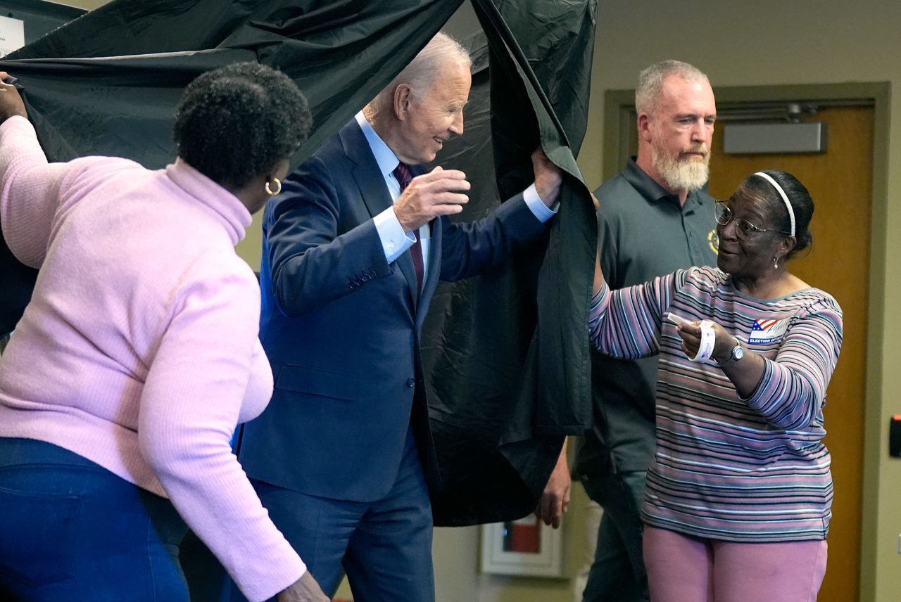 President Joe Biden exits the voting booth after casting his early-voting ballot for the 2024 general elections on October 28, in New Castle, Delaware.