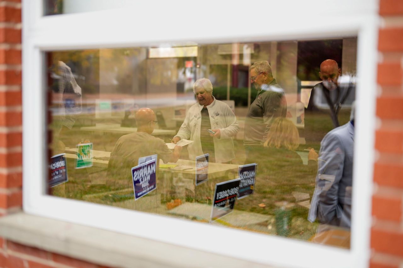 Voters receive their ballots at a polling place on Tuesday in Springfield, Pennsylvania. 