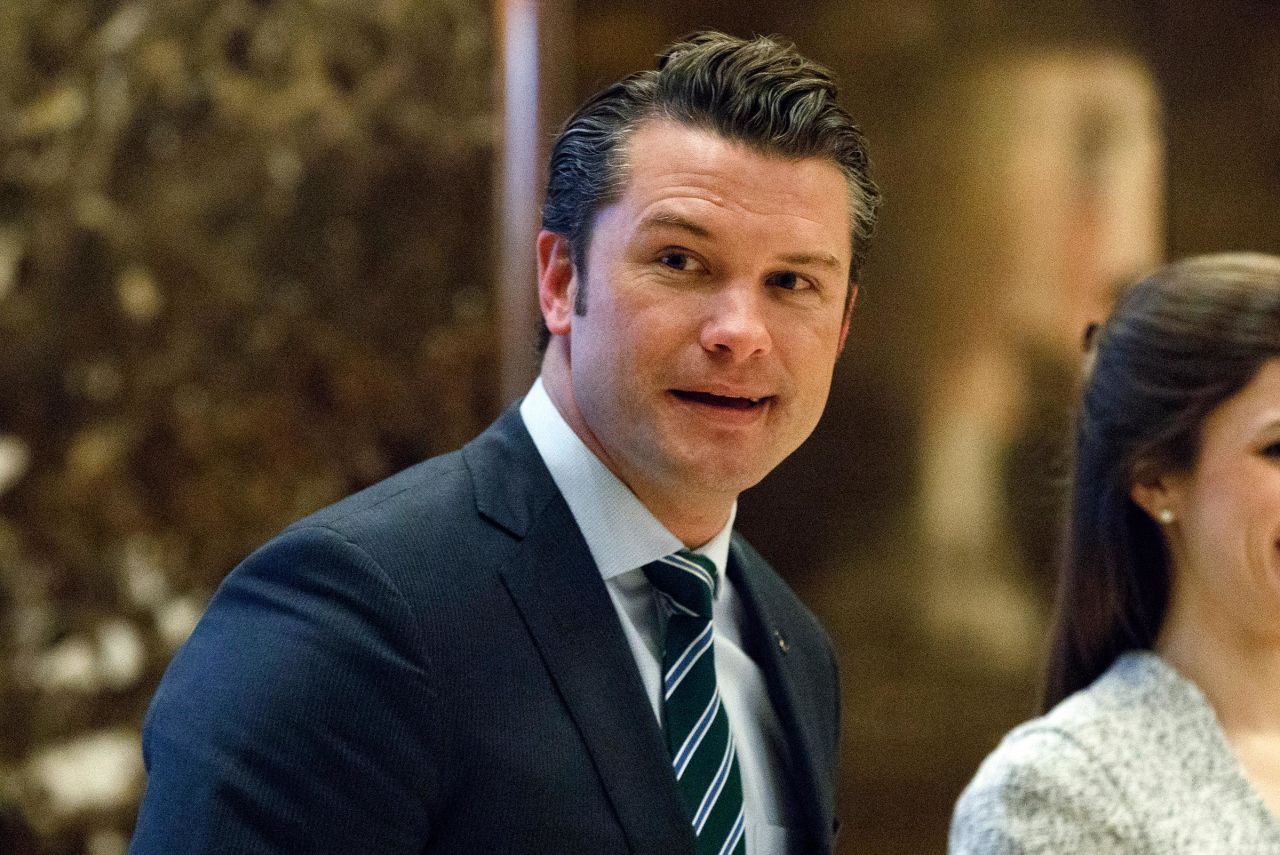 In this December 2016 photo, Pete Hegseth walks to an elevator for a meeting with Donald Trump in New York.