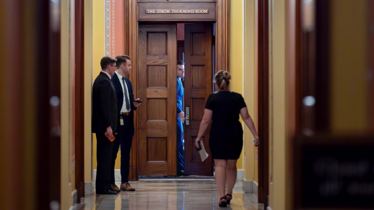 President-elect Donald Trump's nominee to be attorney general, former Rep. Matt Gaetz, closes a door to a private meeting with Vice President-elect JD Vance and Republican Senate Judiciary Committee members at the Capitol in Washington, DC, on November 20. 