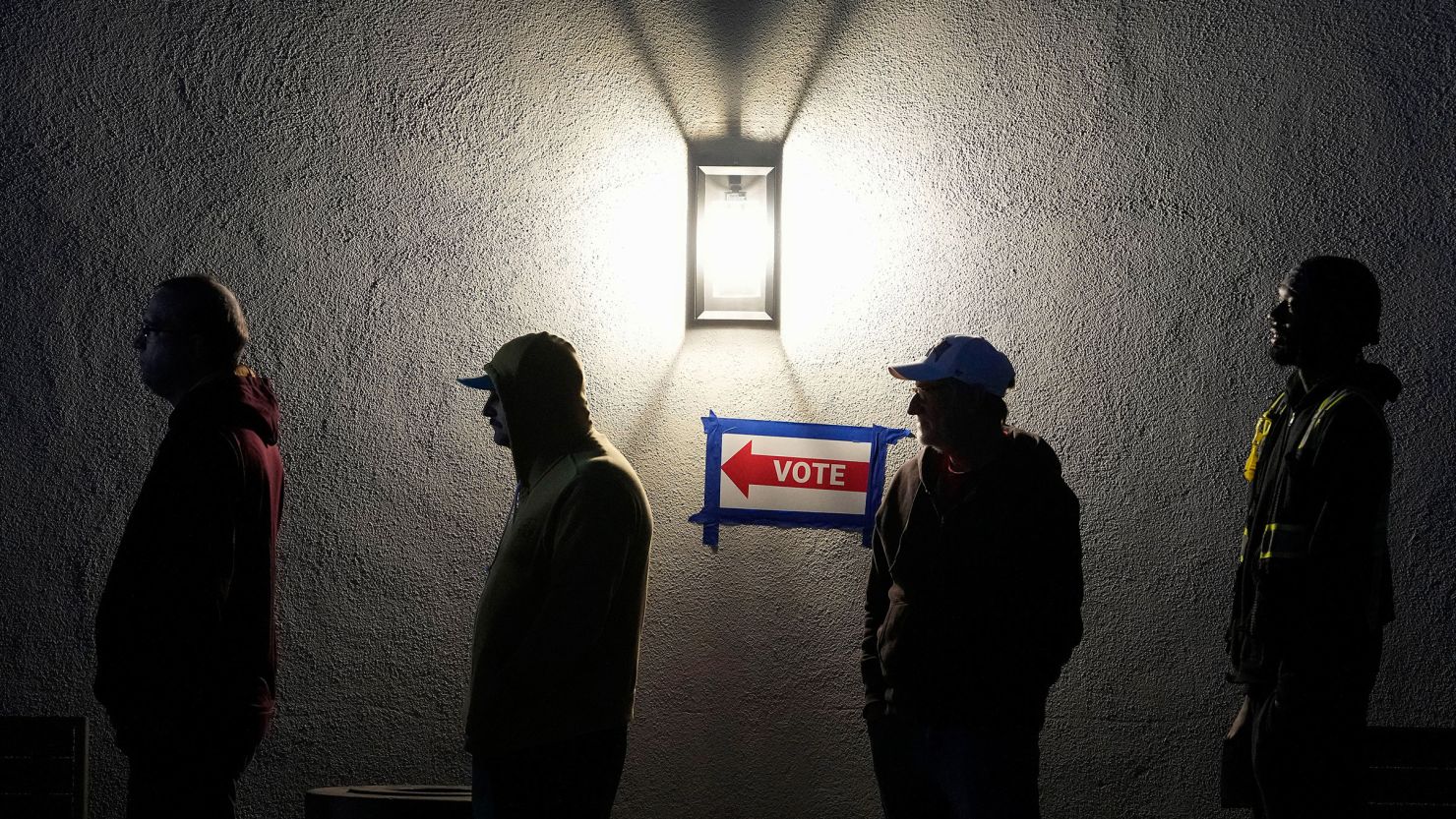 Voters stand in line outside a polling place at Madison Church on November 5, 2024 in Phoenix.