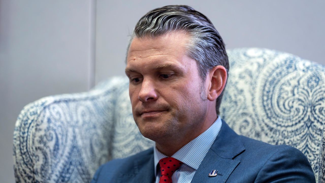 Pete Hegseth listens to reporters during a meeting with Sen. Mike Rounds at the Capitol in Washington, DC, on December 5.
