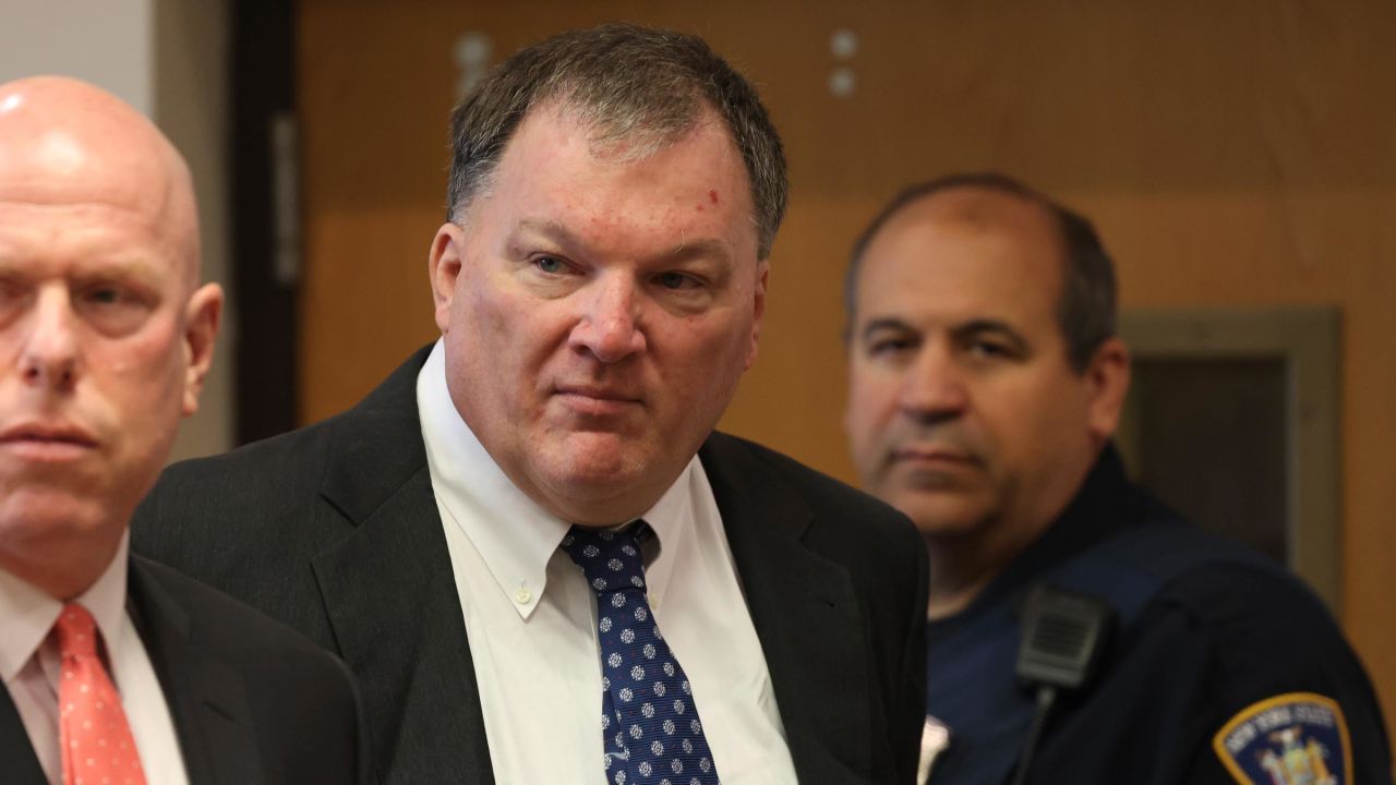 Rex Heuermann, center, charged in the Gilgo Beach serial killings on Long Island, appears for a hearing in July at Suffolk County Court in Riverhead, New York.