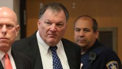 Rex Heuermann, center, charged in the Gilgo Beach serial killings on Long Island, appears for a hearing in July at Suffolk County Court in Riverhead, New York.
