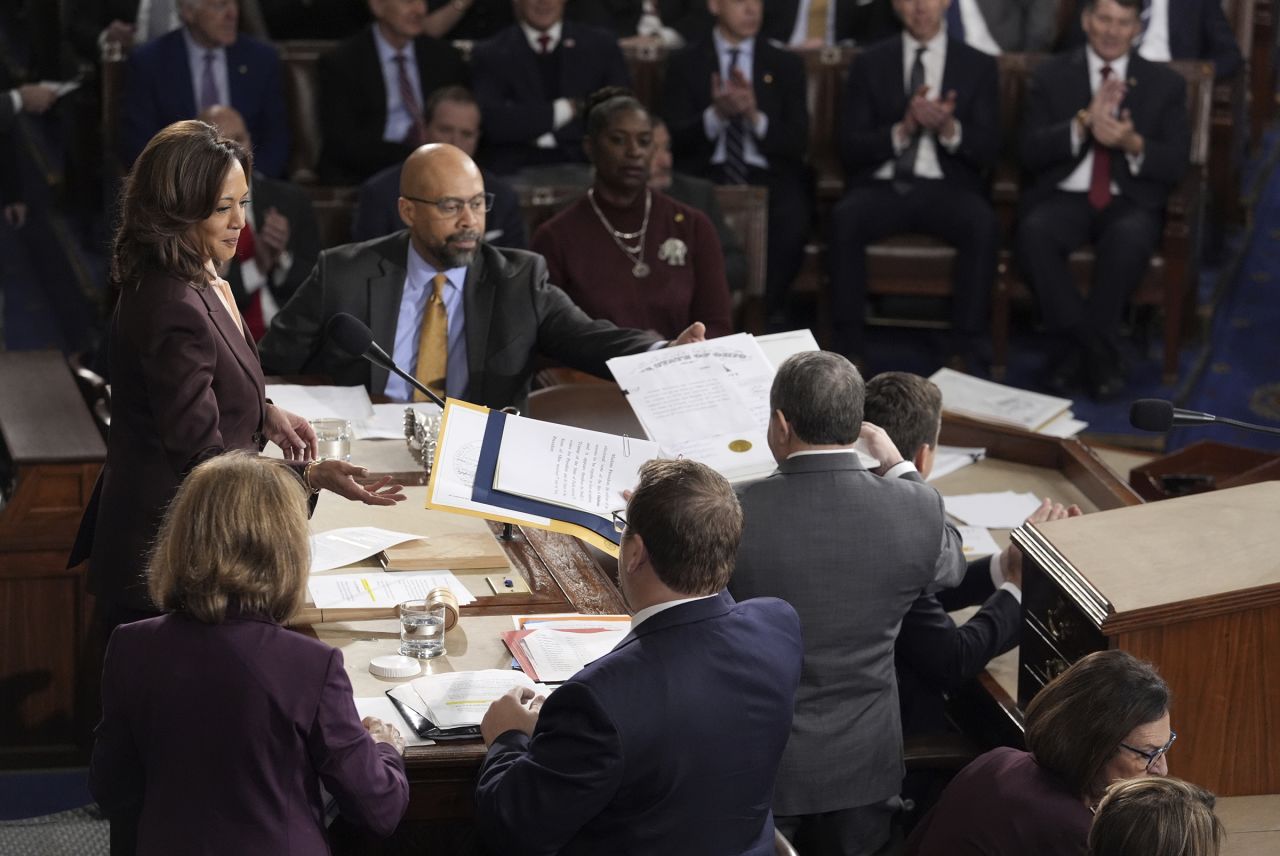 Vice President Kamala Harris is handed a certification as the joint session of Congress convenes to confirm the Electoral College votes, affirming President-elect Donald Trump's victory in the presidential election on Monday, January 6, at the US Capitol in Washington, DC.