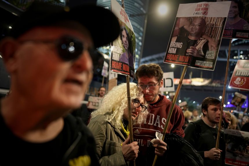 Relatives and friends of people killed and abducted by Hamas react to the announcement of a ceasefire deal as they take part in a demonstration in Tel Aviv, Israel, on January 15.