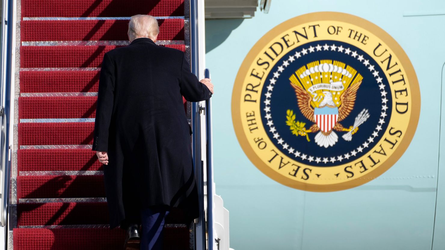 President Donald Trump boards Air Force One at Joint Base Andrews, Maryland, on February 14.