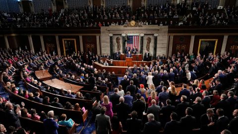 Republicans stand as Democrats sit as President Donald Trump addresses a joint session of Congress in the House chamber at the US Capitol in Washington, DC, on March 4. 
