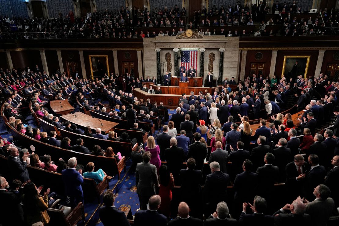 Republicans stand as Democrats sit as President Donald Trump addresses a joint session of Congress in the House chamber at the US Capitol in Washington, DC, on March 4. 