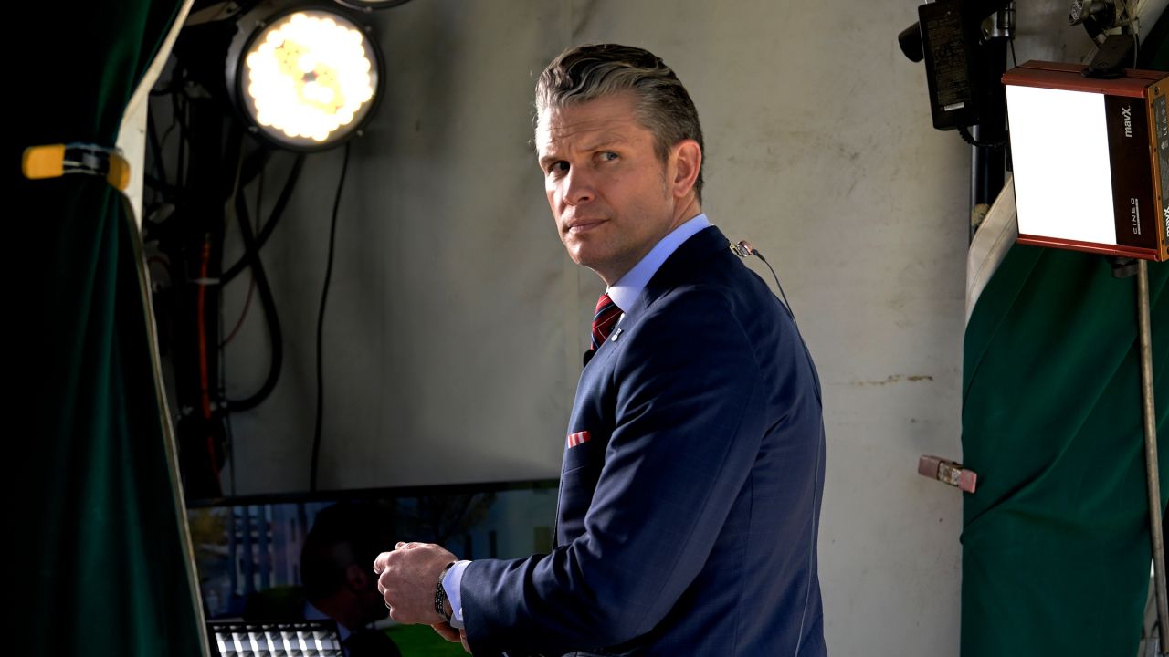 Secretary of Defense Pete Hegseth walks into the White House from Pebble Beach after finishing a talk with Fox TV in Washington DC, on March 21.