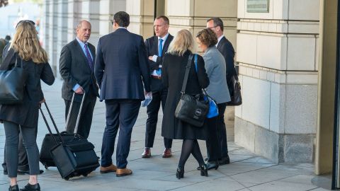AP attorney Charles Tobin, center left, talks with AP White House correspondent Zeke Miller, center with back to camera, and AP chief Washington photographer Evan Vucci, center right, outside the E. Barrett Prettyman Federal Courthouse following a hearing on The Associated Press' lawsuit against the Trump administration to restore access to presidential events on March 27 in Washington, DC. 