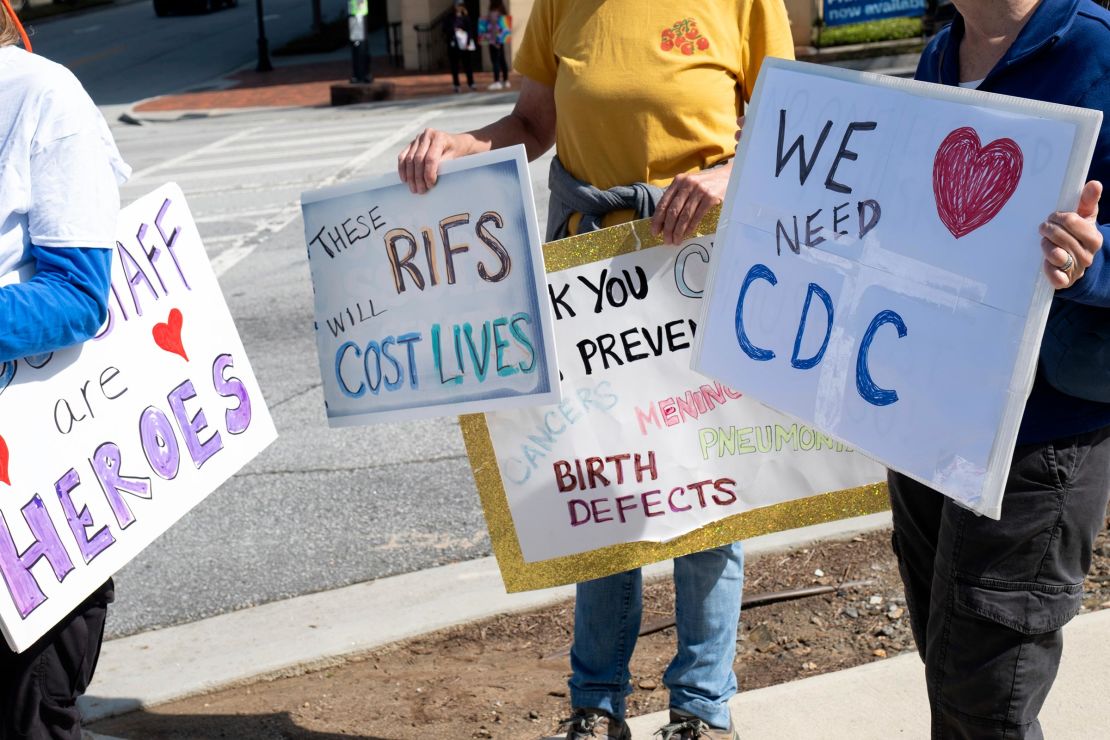 People protest outside of the Centers for Disease Control and Prevention in Atlanta on Tuesday, April 1 after layoffs were announced.