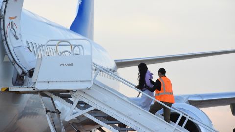 In this October 2023 photo, a Venezuelan migrant boards a plane from Harlingen, Texas.