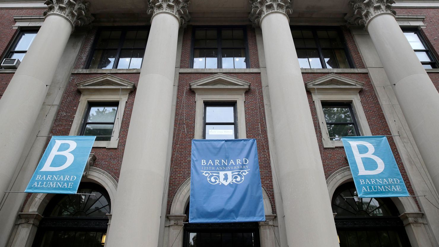 In this 2015 photo, banners hang from a building at Barnard College in New York.