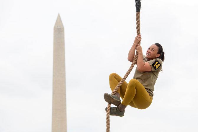 A team member competes in the rope climb portion of the Army fitness competition on the National Mall.