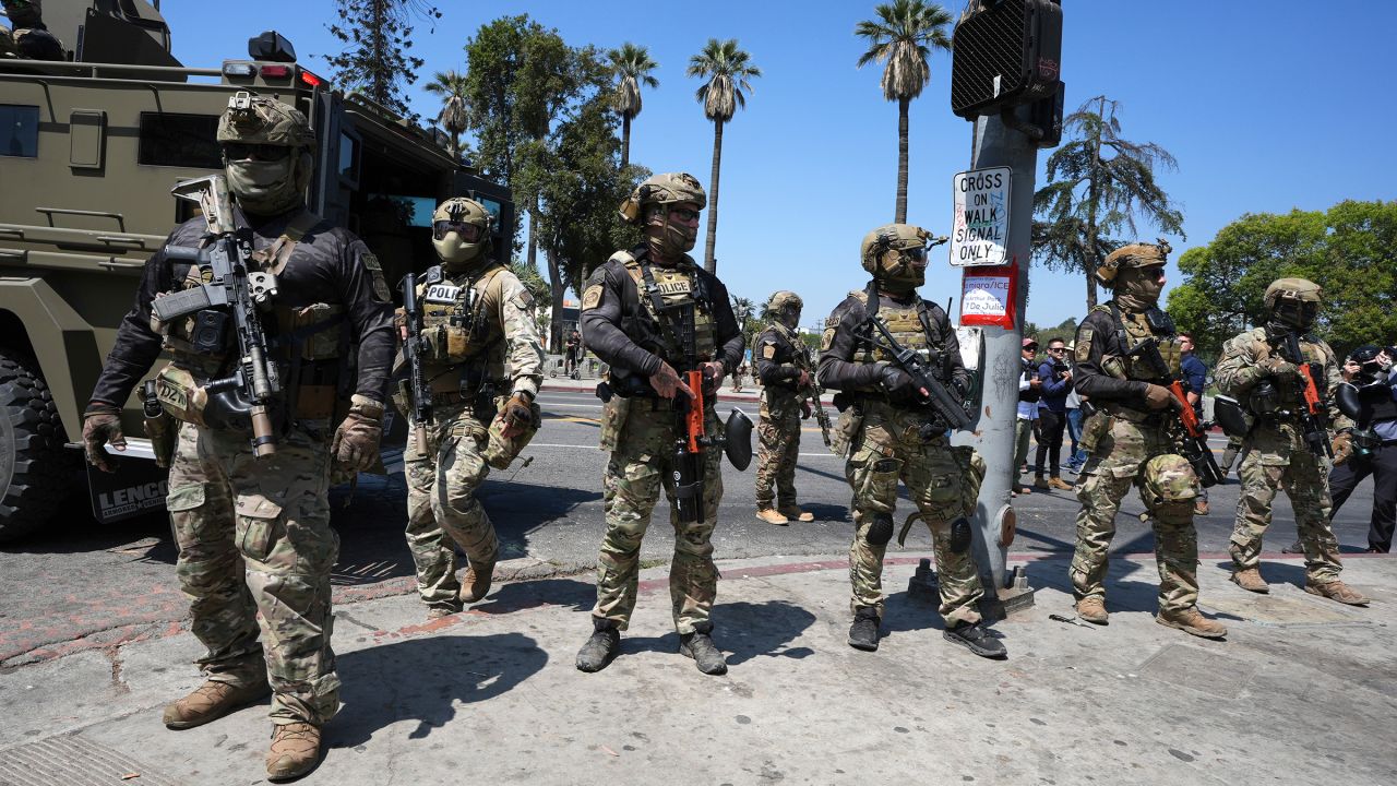 Federal agents stage at MacArthur Park on July 7 in in Los Angeles.