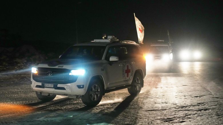 Red Cross convoy carrying the body of a person believed to be a deceased hostage handed over by Palestinians militants makes its way toward the border crossing with Israel, to be transferred to Israeli authorities, in Deir al-Balah, central Gaza Strip, on Friday.