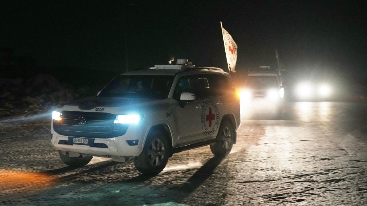 Red Cross convoy carrying the body of a person believed to be a deceased hostage handed over by Palestinians militants makes its way toward the border crossing with Israel, to be transferred to Israeli authorities, in Deir al-Balah, central Gaza Strip, on Friday.