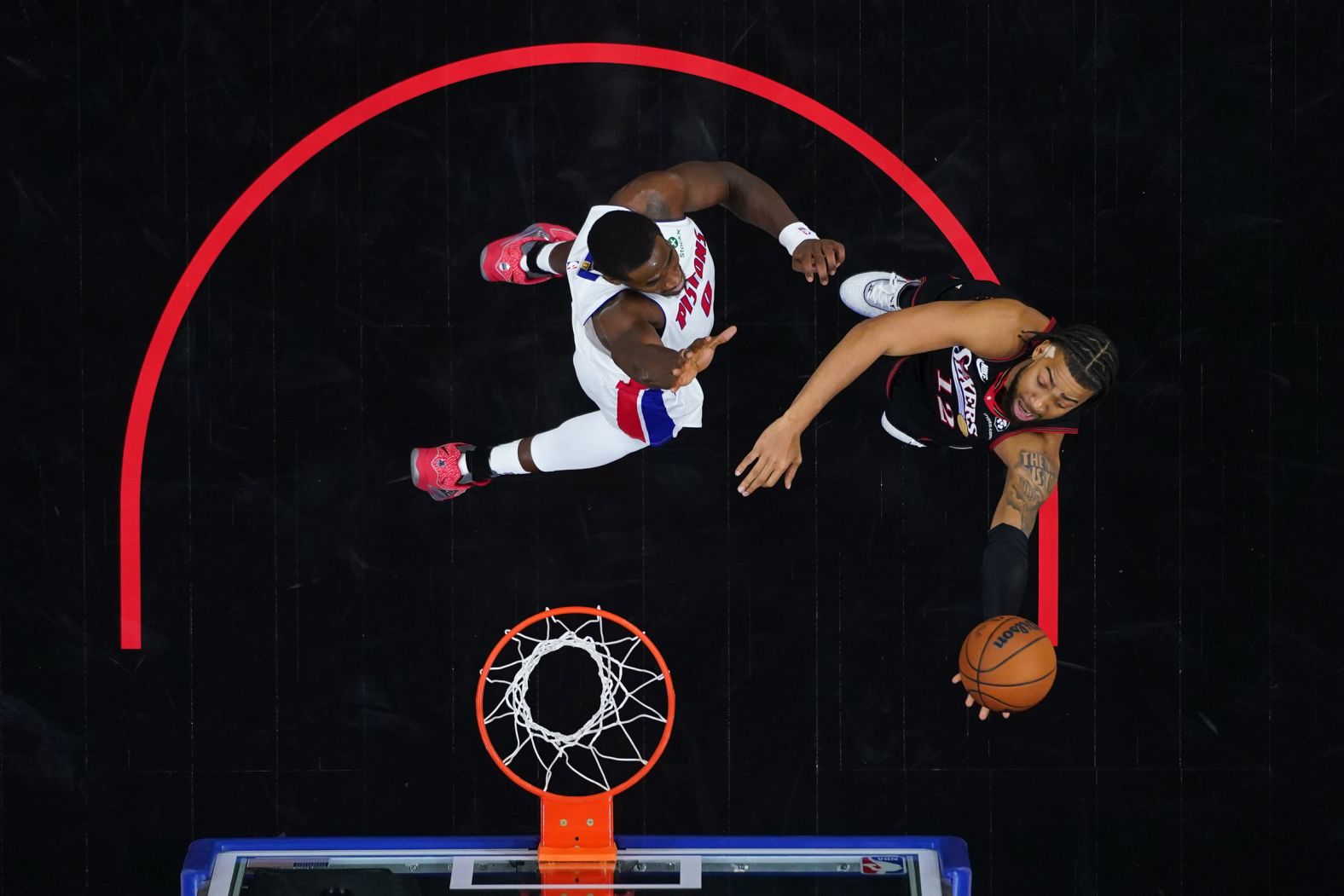The Philadelphia 76ers' Trendon Watford, right, goes up for a shot against the Detroit Pistons' Jalen Duren during an NBA game in Philadelphia on Sunday, November 9.