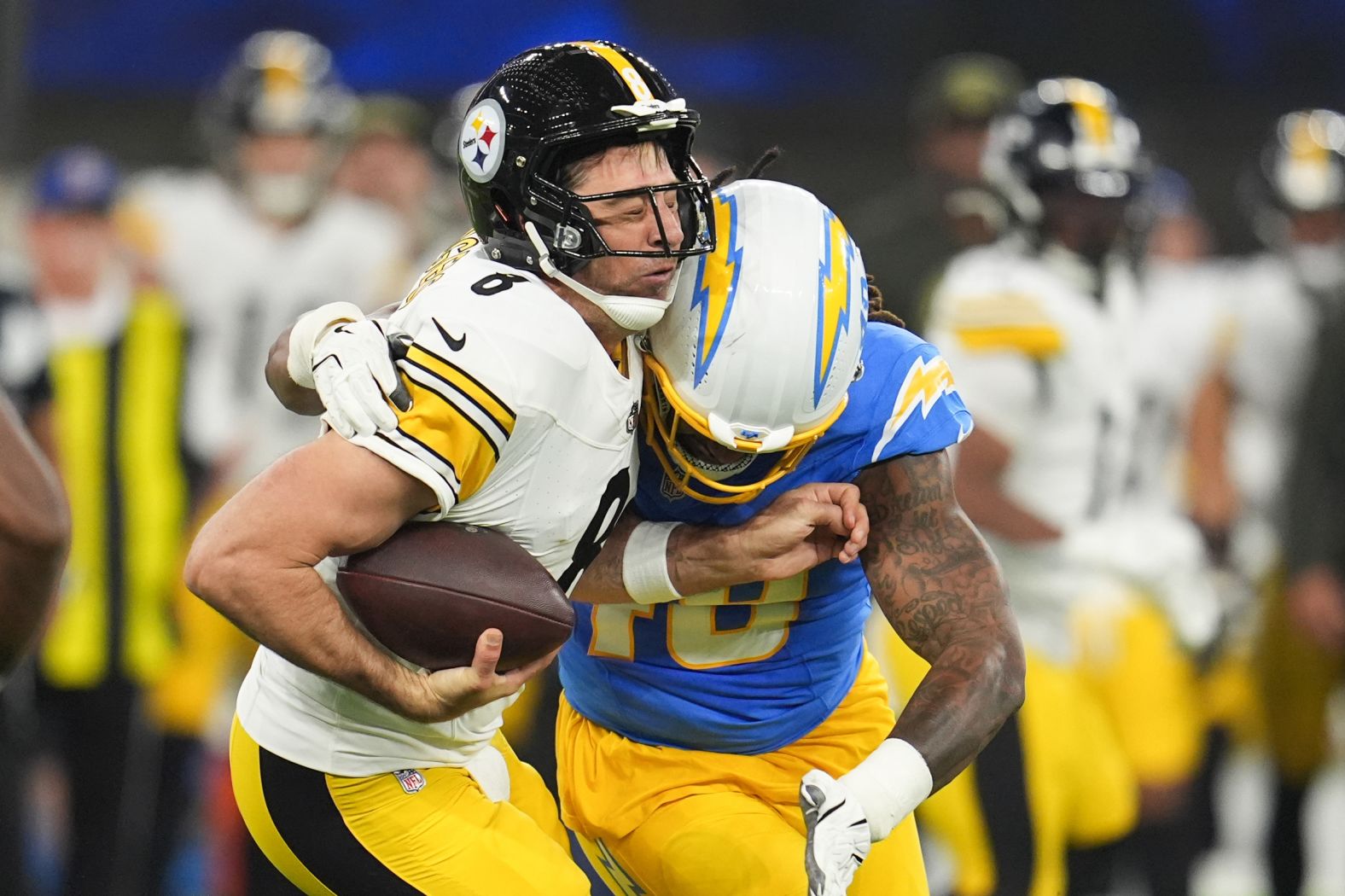 Los Angeles Chargers linebacker Bud Dupree tackles Pittsburgh Steelers quarterback Aaron Rodgers during an NFL game in Inglewood, California, on Sunday, November 9.